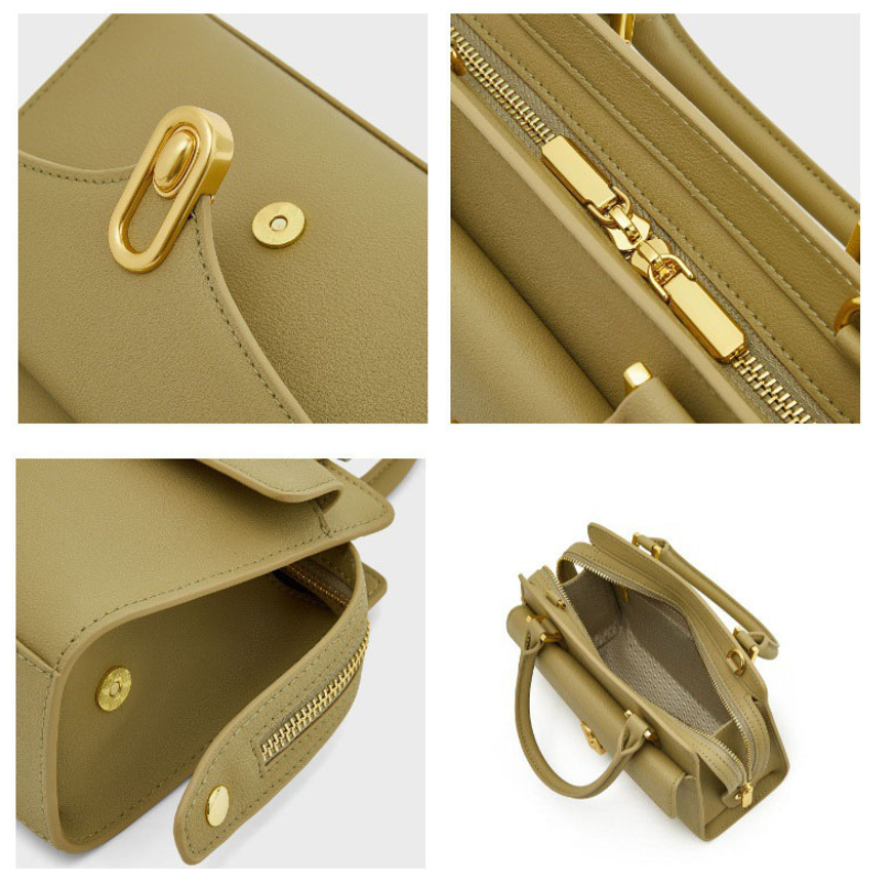 lock buckle leather crossbody bag details showing zipper closure gold hardware and interior compartments