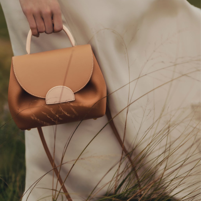 mini leather handbag held in hand elegant leather bag everyday style