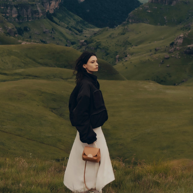 mini leather handbag worn crossbody minimal outfit outdoor style