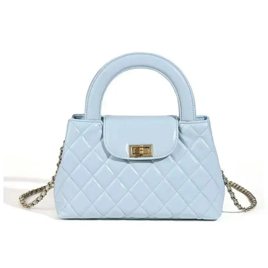 mini quilted top handle bag in light blue with chain strap front view