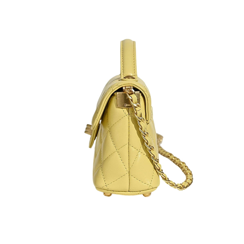 side view of quilted lambskin crossbody bag showing chain strap and slim design