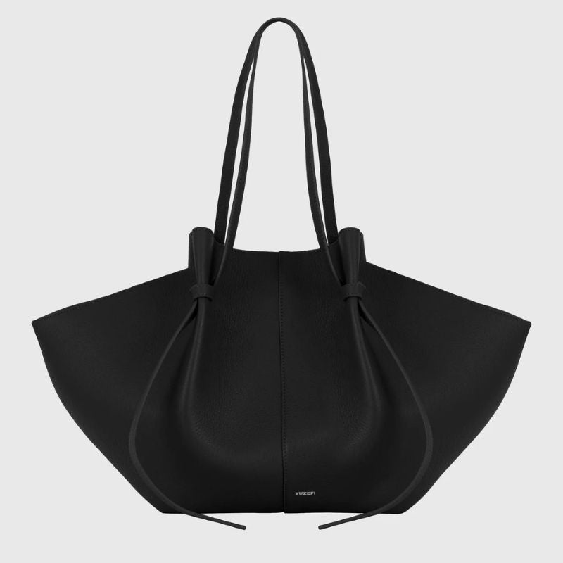 slouchy leather tote bag oversized black front view with shoulder straps