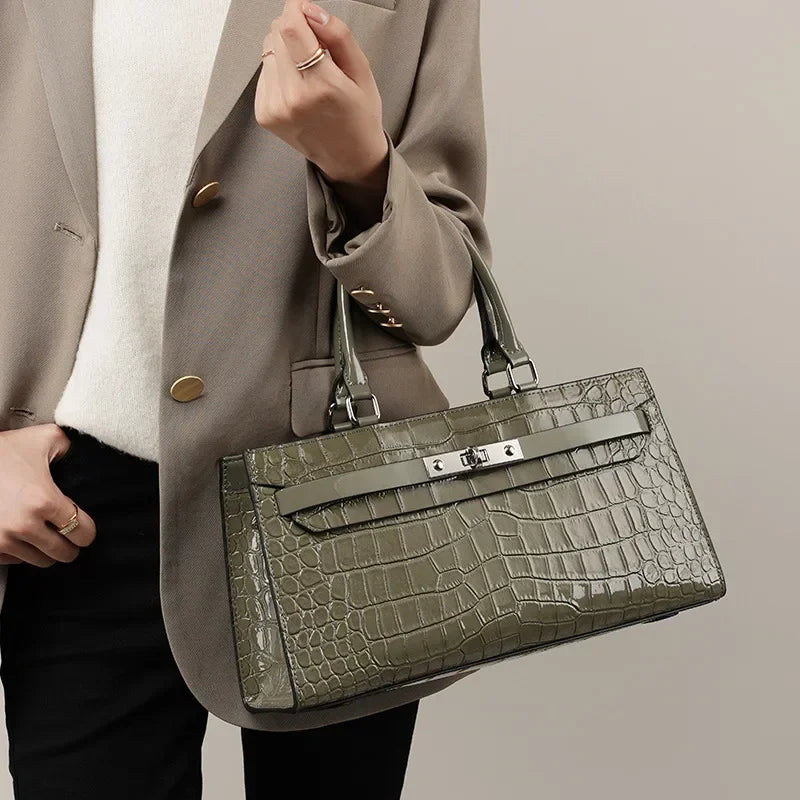 structured leather handbag worn by model crocodile embossed elegant everyday crossbody bag