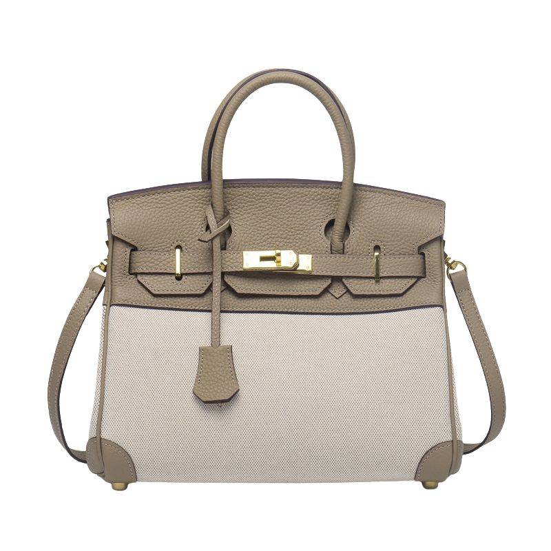 structured top handle bag in olive green leather and canvas with gold hardware