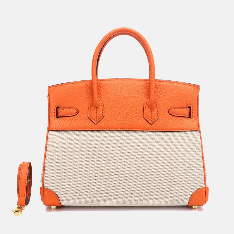 structured top handle bag orange back view with leather handles
