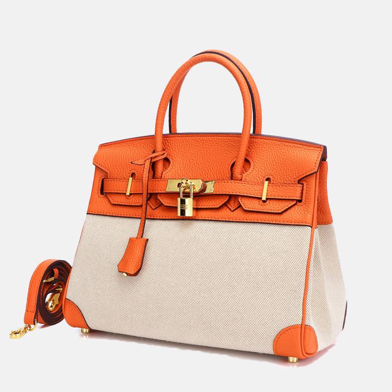 structured top handle bag orange side view with detachable strap