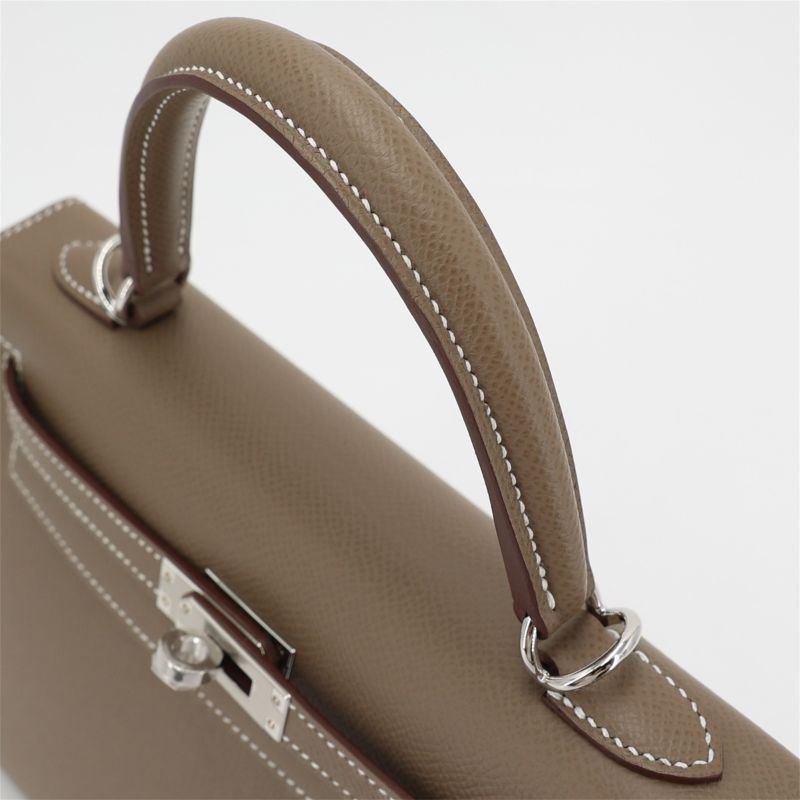 top handle leather bag handle detail stitching and hardware close up