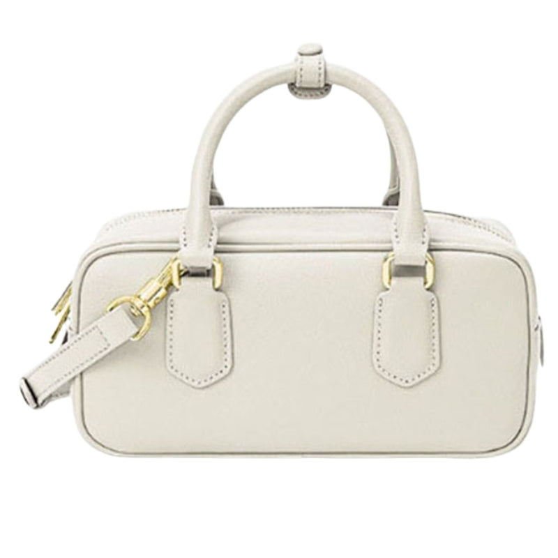 white small leather handbag with zipper compact structured leather bag minimal design
